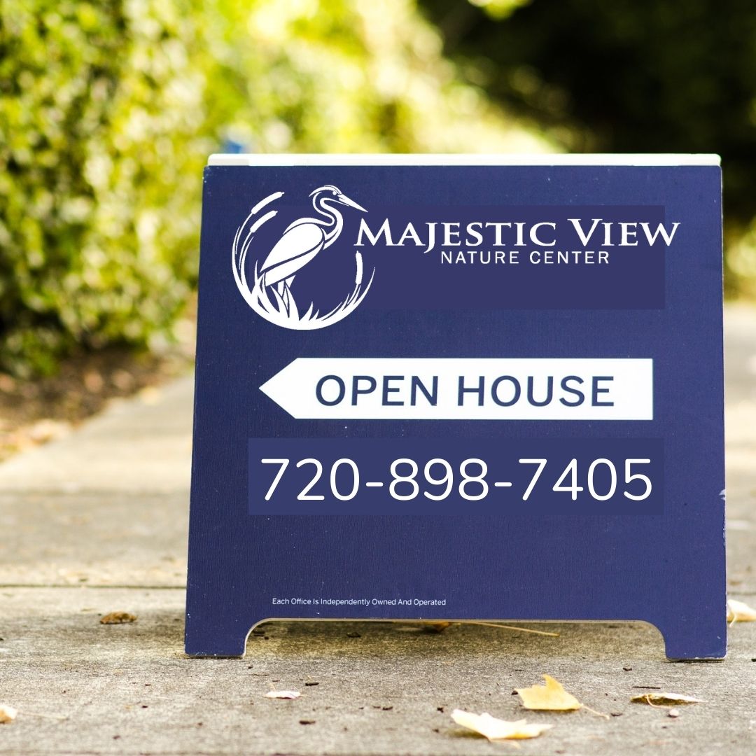 A frame open house sign with Majestic View Nature Center logo and phone number